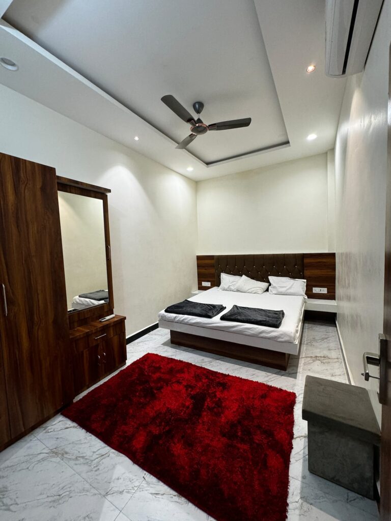 Second bedroom with red rug
