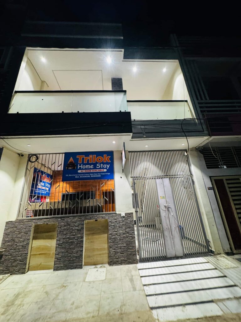 Trilok Home Stay building in Ujjain at night